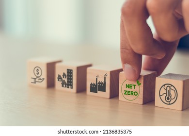 Net Zero Target And Carbon Neutral. Green Business Concept. Climate Changing Problems Solving Goals.
Putting Wooden Cubes With Net Zero Icon And Pollution Sources Icons On Smart Background, Copy Space