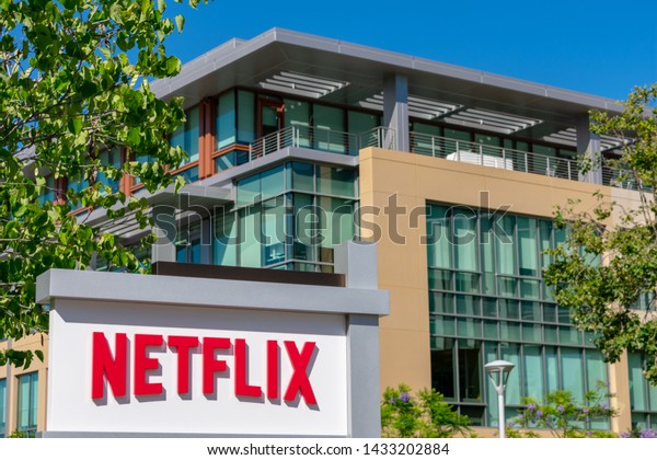 Netflix sign\
and logo near media company headquarters in Silicon Valley - Los\
Gatos, California, USA - June 23,\
2019