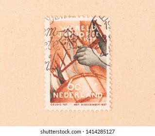 THE NETHERLANDS 1950: A Stamp Printed In The Netherlands Shows Someone Playing The Drums, Circa 1950