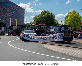 Netherlands - 4 july 2022, Hilversum: Farmers blocking entrance Broadcast and Media centre MEDIA PARK to protest against nitrogen policy, FAKE NEWS flag.