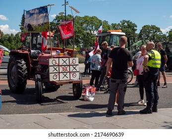 Netherlands - 4 july 2022, Hilversum: Noughts and crosses flag on tractor at farmers protest in Holland against nitrogen policy