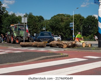 Netherlands - 4 july 2022, Hilversum: Farmers blocking entrance Broadcast and Media centre MEDIAPARK with tractors and logs to protest against nitrogen policy