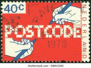 NETHERLANDS - CIRCA 1978: A Stamp Printed In The Netherlands, Dedicated To The Introduction Of New Postal Code, Shows The Hand Of A Writing Text, Circa 1978