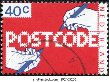 NETHERLANDS - CIRCA 1978: A Stamp Printed In The Netherlands, Dedicated To The Introduction Of New Postal Code, Shows The Hand Of A Writing Text, Circa 1978