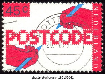 NETHERLANDS - CIRCA 1978: A Stamp Printed In The Netherlands, Dedicated To The Introduction Of New Postal Code, Shows The Hand Of A Writing Text, Circa 1978