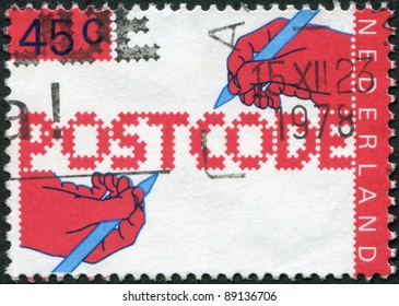 NETHERLANDS - CIRCA 1978: A Stamp Printed In The Netherlands, Dedicated To The Introduction Of New Postal Code, Shows The Hand Of A Writing Text, Circa 1978