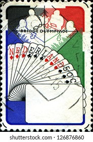  NETHERLANDS - CIRCA 1980: A stamp printed in  Netherlands shows Bridge Players, Netherlands Hand, 6th Bridge Olympiad, Valkenburg, circa 1980