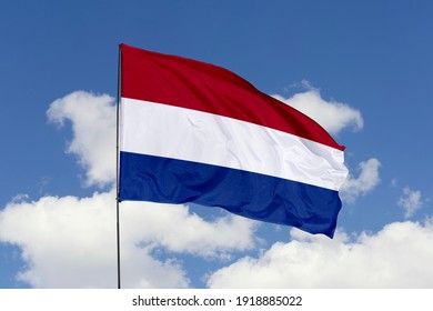 Netherlands flag isolated on the blue sky with clipping path. close up waving flag of Netherlands. flag symbols of Netherlands. - Shutterstock ID 1918885022