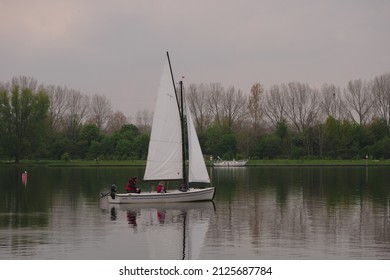 Netherlands, Roermond, Maasplassen, 4302021, 143 p.m., on the lake a Valk Jolle, a small open sailing boat with gaff sails and a fixed keel. The boat is a gaff-rigged sloop.