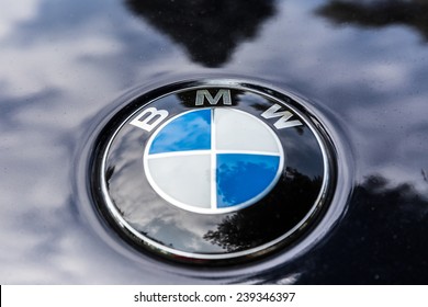 NETHERLANDS - SEPTEMBER 22, 2014: Parked BMW with recognisable round logo on September 22, 2014 in the Netherlands. The BMW logo evolved from the logo of aircraft engine manufacturer Rapp.