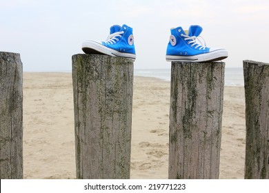 NETHERLANDS, SEPTEMBER 25, 2014: All Star Converse Sneakers On A Beach.