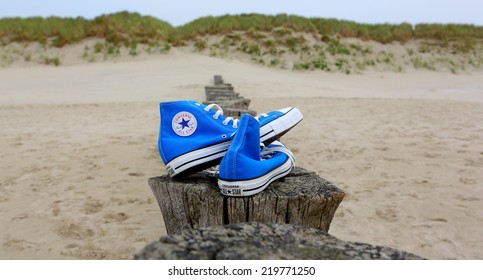 NETHERLANDS, SEPTEMBER 25, 2014: All Star Converse Sneakers On A Beach.