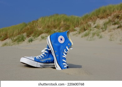 NETHERLANDS, SEPTEMBER 25, 2014: All Star Converse Sneakers On A Beach.