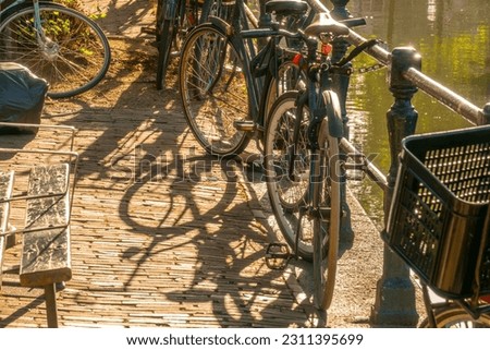 Similar – Fahrräder in der Nähe von niederländischen Häusern in Amsterdam City