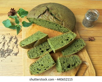 Nettles green round bread, weed dough, wild plants cooking 
