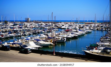 Nettuno, Italy - July 14, 2017: View of the modern port of Neptune from a terrace of the ancient village of the Lazio city. Opened August 2, 1986