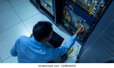 Network administrator working in data center room