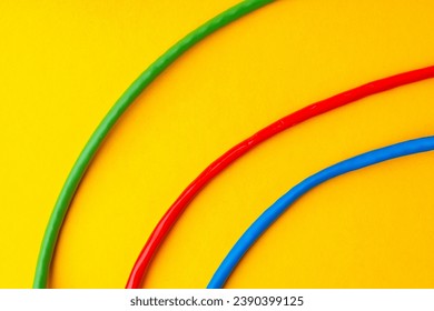 Network cable on yellow background studio shot