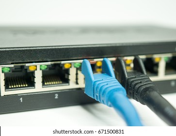 network cable and ports of a switch - Shutterstock ID 671500831