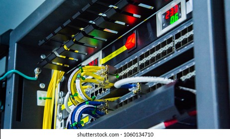 Network cables connected to ethernet ports. - Shutterstock ID 1060134710