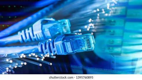 network cables with fiber optical background - Shutterstock ID 1395760895