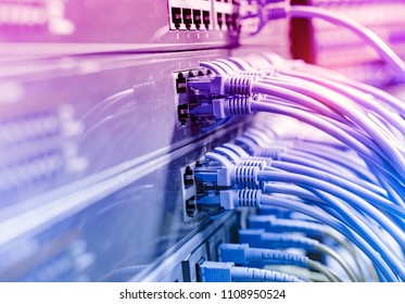 Network cables in switch and firewall in cloud computing data center server rack