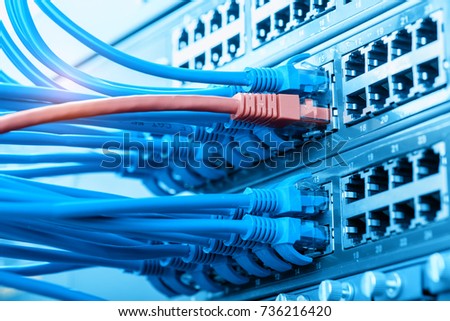 Network cables in switch and firewall in cloud computing data center server rack