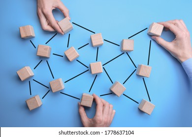 Network Community - man hands put the wooden bricks with person icon on them to blue background which are interconnected. connected people - Shutterstock ID 1778637104