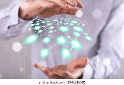 Network concept between hands of a man in background