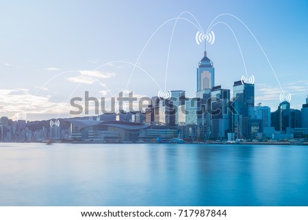 Network conection concept on blue tone cityscape business district background.