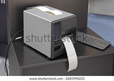 Network Connected Label Printer Machine at Work Desk in Factory