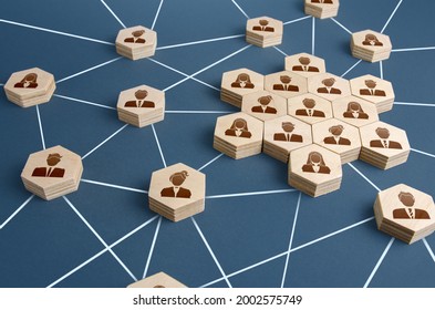 A network of connected people with a large group of employees. Organized communication system between company workers. Decentralized networking communication. Partnerships, business relations - Shutterstock ID 2002575749