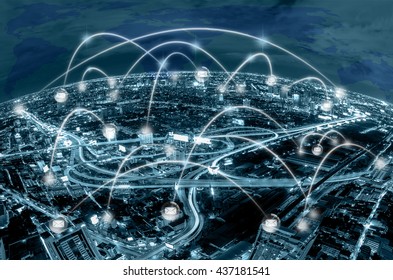 Network connection line between building over the top view of cityscape background and world map background which dicut each elements, cool tone color,business social network and connection concept