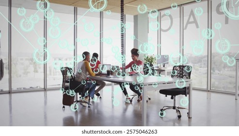 Network of connections and data processing image over business meeting in office. Technology, digital, connectivity, brainstorming, teamwork, collaboration
