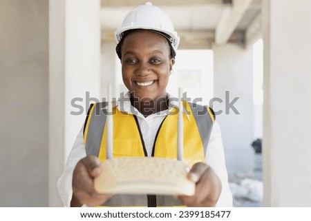 Network engineer hand holding wireless wifi access point internet router happy smiling for professional setup install right position home networking concept.