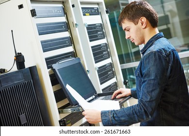 Network Engineer Working In Server Room