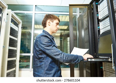 network engineer working in server room - Powered by Shutterstock - Get 15% off with code: PIKWIZARD15