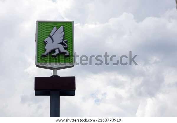 A
network of gas stations in Ukraine with an OKKO store and cafe.
Logo against a blue sky with clouds. Filling station, retail trade
in petroleum products. Ukraine, Kyiv - May 23,
2022
