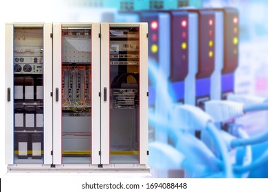 Network hardware. Server cabinet Concept - work as a system administrator. Fiber optic cables stretch to the server. Concept - setup and maintenance of servers. Sale of network equipment.