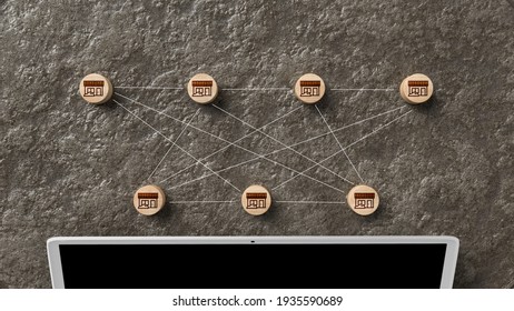 Network Of House Icons On Small Round Wooden Blocks Above A Laptop Computer In A Connectivity And Communication Concept Viewed From Overhead