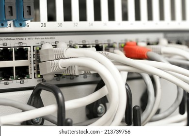 Network Hub And Cables Connected To Servers In A Datacenter