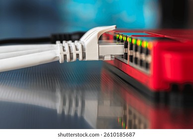 Network infrastructure components, a switch with connected cabling, in a telecommunication room