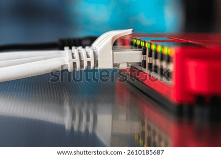 Network infrastructure components, a switch with connected cabling, in a telecommunication room