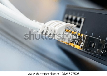 Network infrastructure components, switch with connected cable
