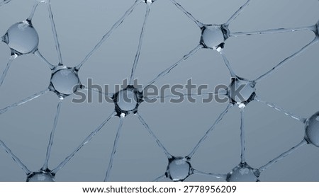 A network of interconnected water droplets forms geometric pattern on smooth surface