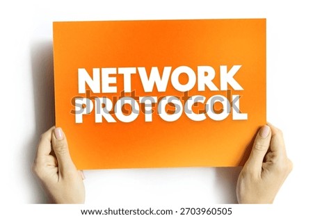 NETWORK PROTOCOL text on card in hands. Technology and communication concept for digital data transmission, connection standards, and system integration