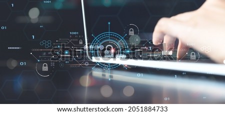 Network security, personal data privacy protection , digital crime concept. Person working on laptop computer with padlock icon and internet technology networking on innovative virtual interface