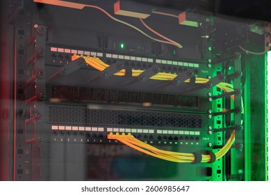 Network server with multiple yellow cables and green LED indicators