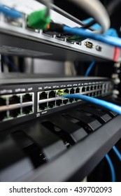 Network switch and ethernet cables,Data Center Concept To communicate - Shutterstock ID 439702093