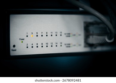 Network switch front panel with LED indicators showing power status and port activity. Concept of data flow, connectivity and network monitoring.